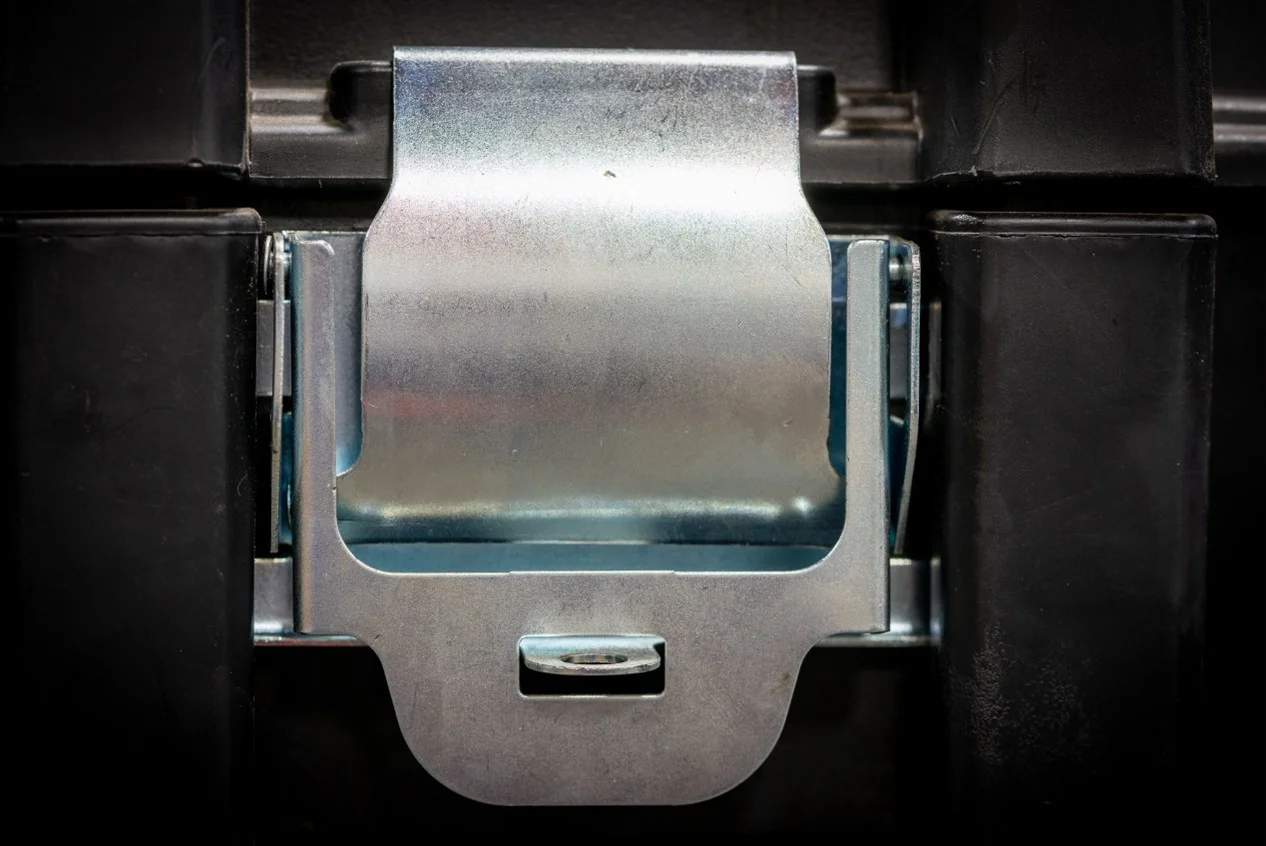 Metal latch on a black storage chest